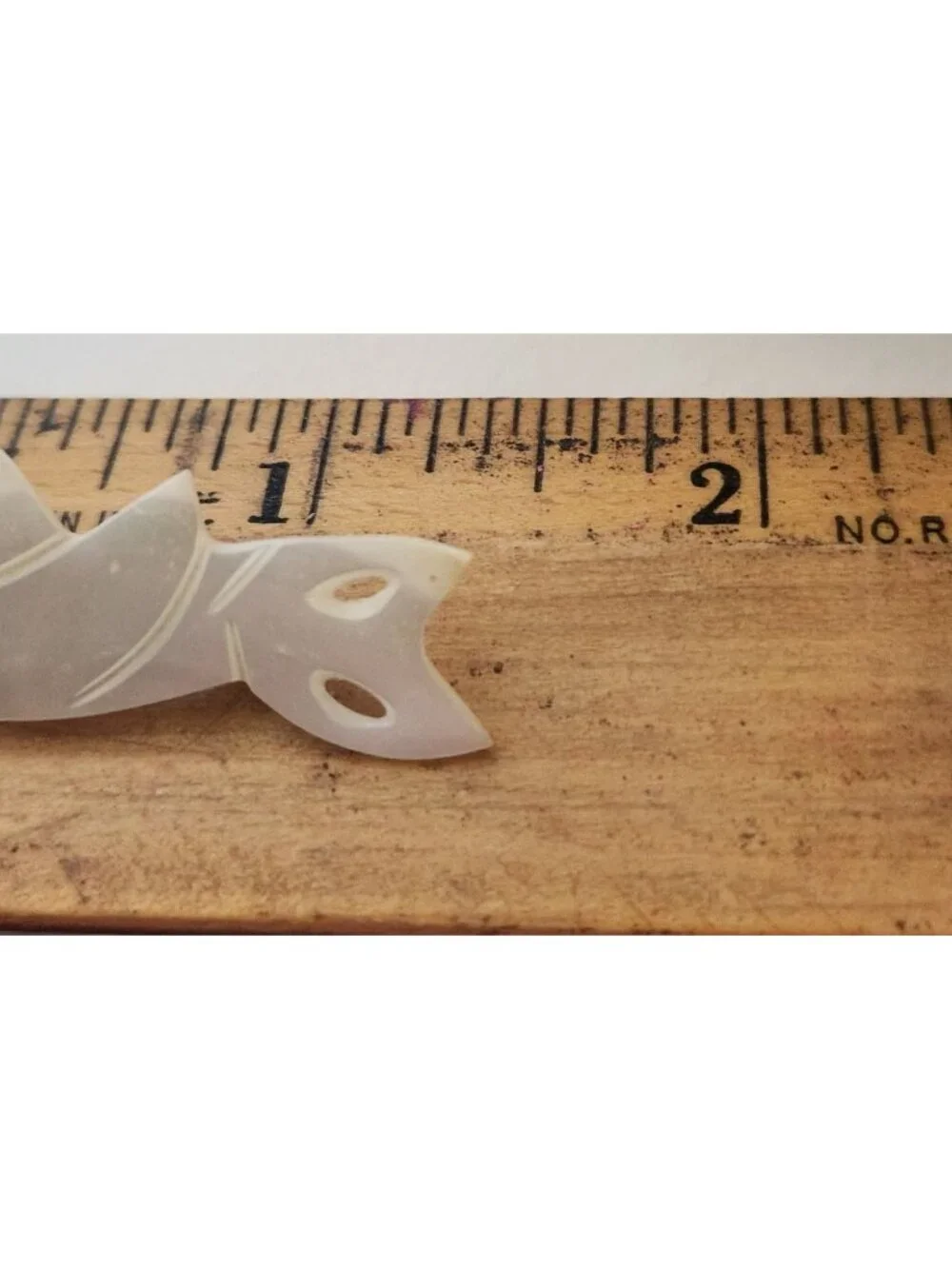 hand-carved mother-of-pearl or shell cat figural brooch